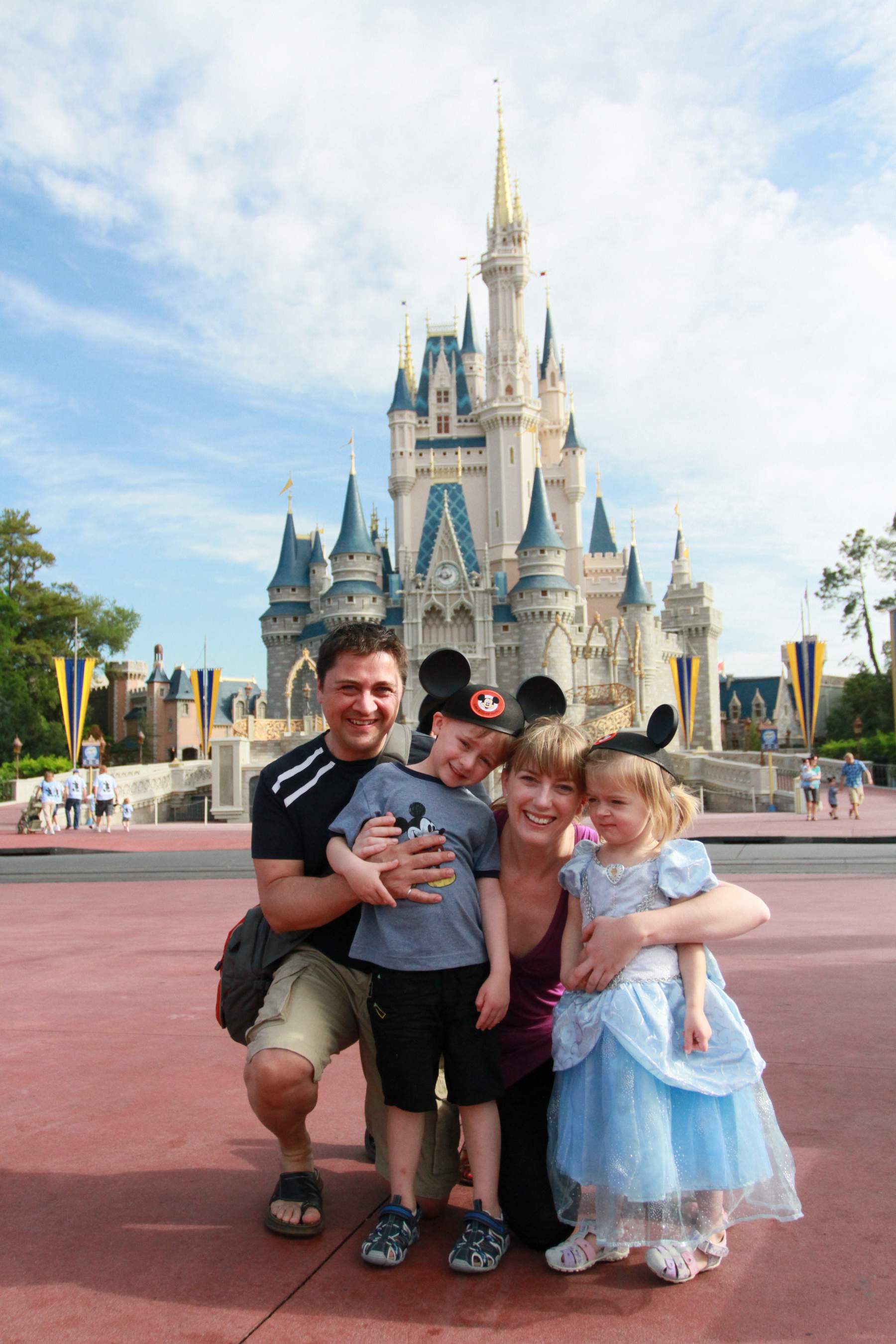Family portrait in front of the castle in Walt Disney World Florida 
